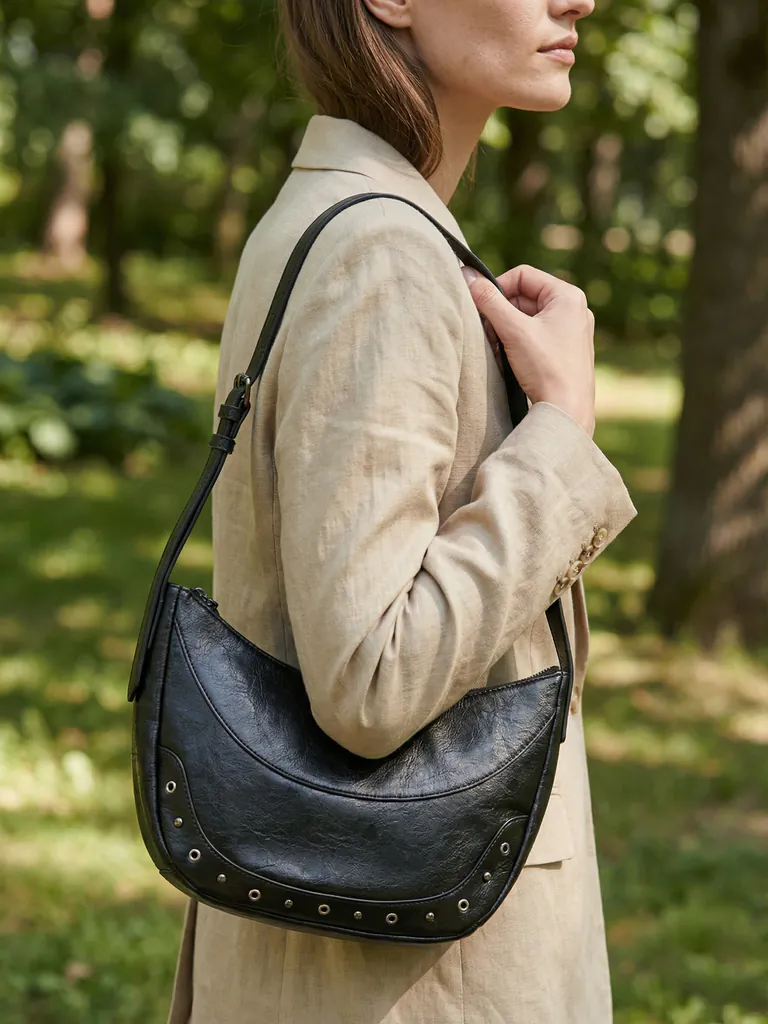 AI-generated on-model photo of the same black shoulder bag
